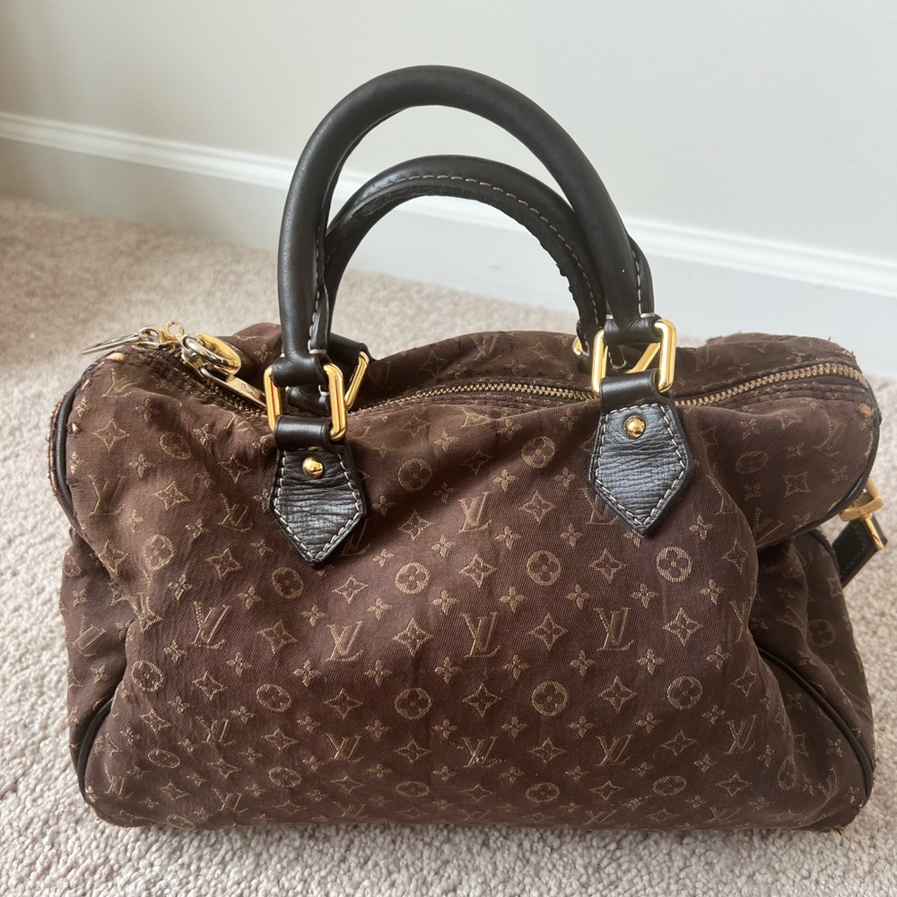 Authentic Louis Vuitton handbag.Some areas in which stitching is seen.
